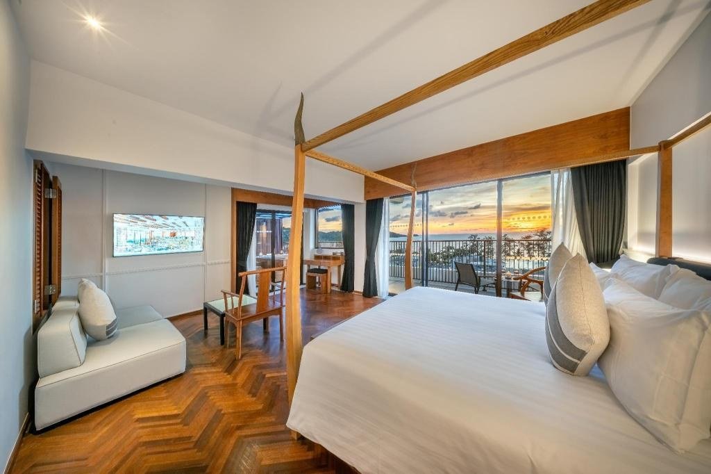 Deluxe Corner King Room - Bedroom at Patong Beach Hotel by See2Sea