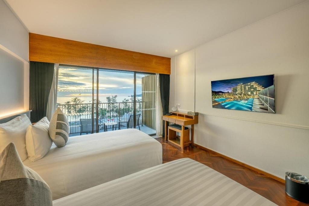 Deluxe Ocean Twin - Bedroom at Patong Beach Hotel by See2Sea