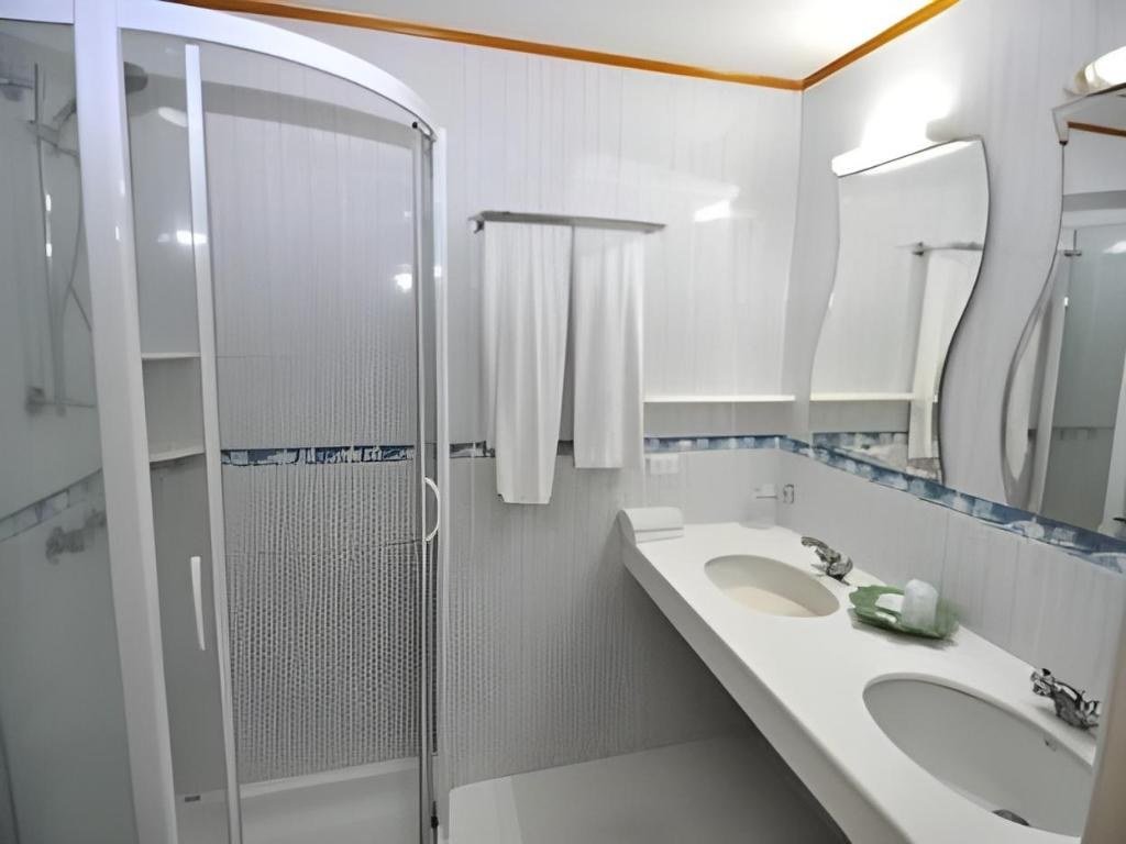 Bathroom at Swiss Palm Beach Hotel